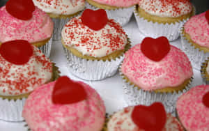 Delectable Pink Cupcakes On Display Wallpaper