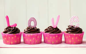 Delectable Pink Cupcakes With Whipped Cream Wallpaper