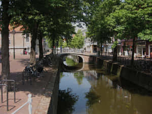 Delft Canal Viewwith Bridge Wallpaper