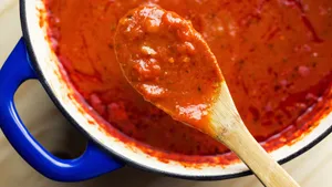 Delicious And Vibrant Red Sauce In A Pan Wallpaper