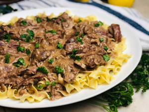 Delicious Beef Stroganoff Served Over Reginette Pasta Wallpaper