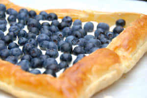 Delicious Blueberry Tart With Fresh Cream Wallpaper