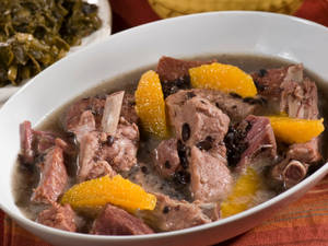 Delicious Brazilian Feijoada Stew Served In A White Bowl Wallpaper