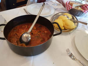 Delicious Brudet Stew Served In Table Wallpaper