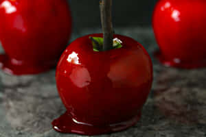 Delicious Candy Apples On Display Wallpaper