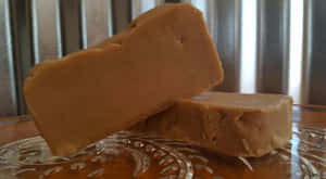 Delicious Homemade Penuche Fudge On A Rustic Wooden Board Wallpaper