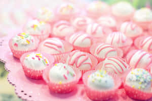 Delicious Pink Cupcakes On Display Wallpaper