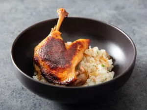 Delicious Singaporean Crispy Koji Duck Rice Confit. Wallpaper