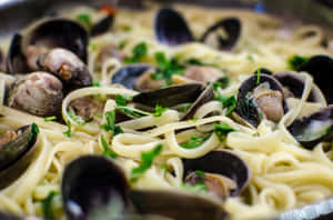 Delicious Spaghetti Alla Vongole Perfectly Captured In A Macro Shot Wallpaper