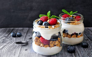 Deliciously Nutritious Bowl Of Yogurt With Berries Wallpaper