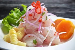 Delightful Ceviche Dish Served With Corn, Onions, And Sweet Potatoes Wallpaper