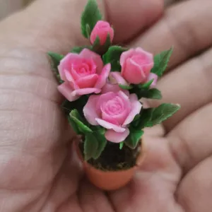 Delightful Miniature Roses In Full Bloom Wallpaper
