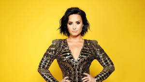 Demi Lovato Black And Gold Outfit Wallpaper