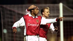 Dennis Bergkamp And Thierry Henry Showcasing Skills During Match With Derby County Wallpaper