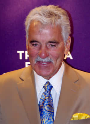 Dennis Farina In A Captivating Pose Wallpaper