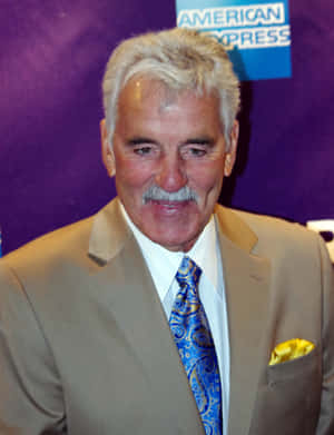 Dennis Farina In A Suave And Sophisticated Pose Wallpaper