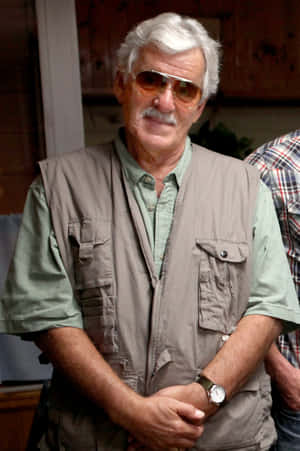 Dennis Farina Posing For A Photograph Wallpaper