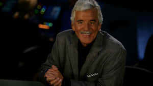 Dennis Farina Smiling At The Camera Wallpaper