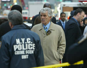 Dennis Farina Striking A Pose In A Suit And Tie Wallpaper