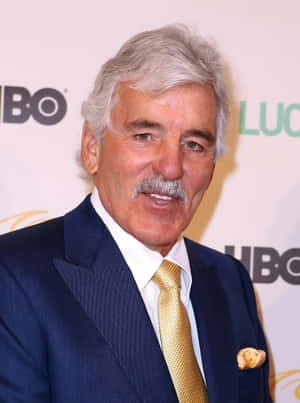 Dennis Farina, The Legendary Actor, Posing For A Photoshoot Wallpaper