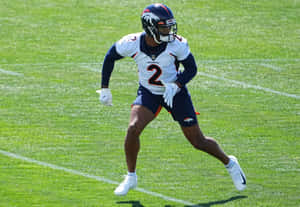 Denver_ Broncos_ Player_ In_ Action Wallpaper