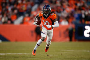 Denver Broncos Player Running With Football Wallpaper