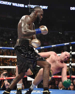 Deontay Wilder Knockdownin Boxing Match Wallpaper