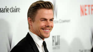 Derek Hough Smiling At Event Wallpaper