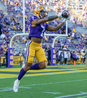 Derek Stingley Jr Catching The Football Wallpaper