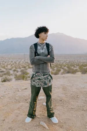 Desert Contemplation Young Man Wallpaper