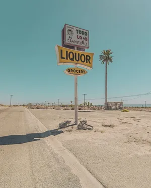 Deserted Roadside Liquor Store Sign Wallpaper
