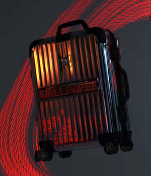 Designer Suitcasewith Red Light Trails Wallpaper