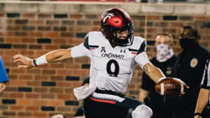 Desmond Ridder Cincinnati Quarterback Action Shot Wallpaper