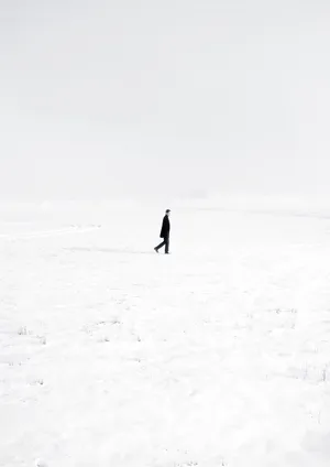 Desolate Snow Land Portrait Lonely Man Wallpaper