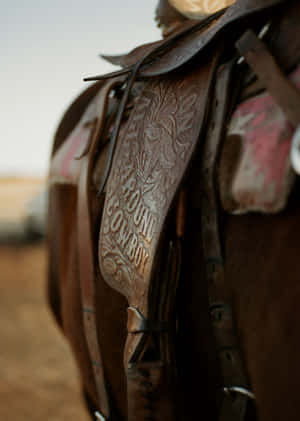 Detailed Cowboy Saddle Carving Wallpaper