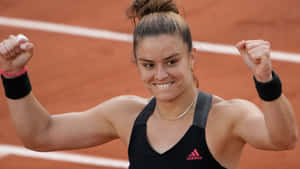 Determined Maria Sakkari In Action Wallpaper