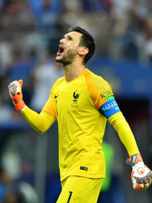 Determined Soccer Captain Leading His Team Wallpaper