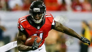 Determined Wide Receiver In Action Wallpaper