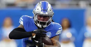 Detroit Lions Player Catching Football Wallpaper