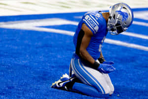 Detroit Lions Player Kneelingon Field Wallpaper