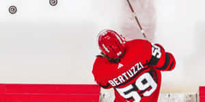 Detroit Red Wings Star Tyler Bertuzzi In Action Wallpaper