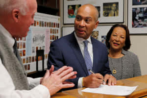 Deval Patrick Engaged In Document Signing Wallpaper