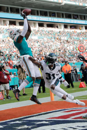 Devante Parker Spectacular Catch Against Defender Wallpaper