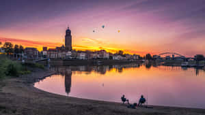 Deventer Skylineat Sunsetwith Hot Air Balloons Wallpaper