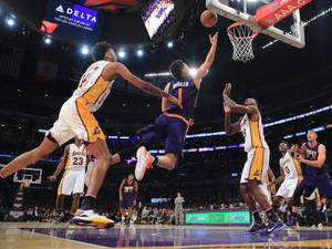 Devin Booker Dynamic Midair Layup Wallpaper