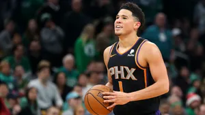 Devin Booker Holding Ball Photograph Wallpaper