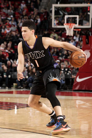 Devin Booker In Black Phx Jersey Wallpaper