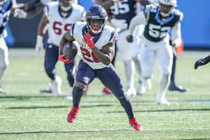 Devin Singletary In Action During Game Wallpaper