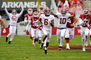 Devonta Smith In Action During Football Game Wallpaper