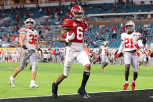 Devonta Smith In Action During Game Wallpaper